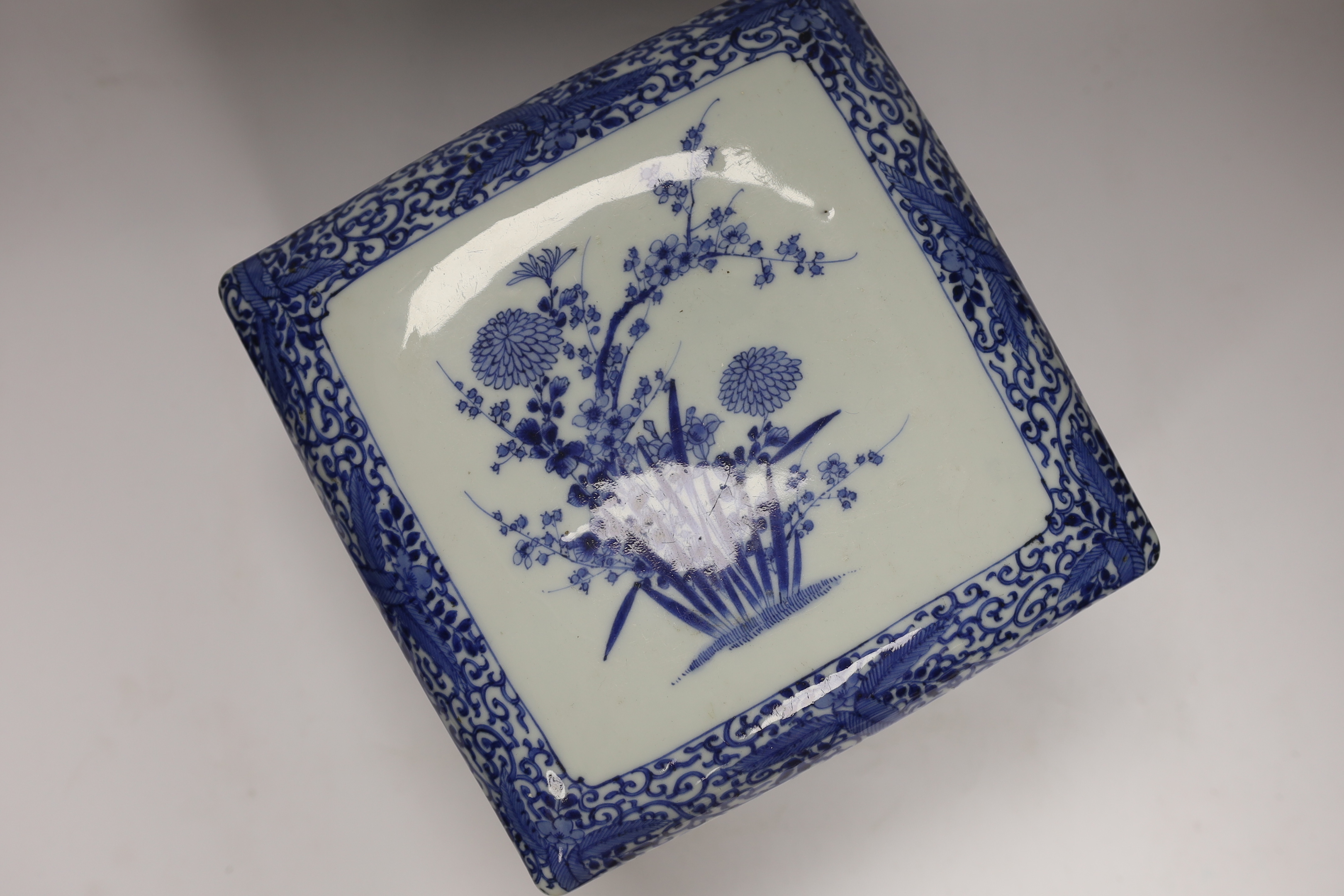 A Japanese blue and white floral, two tier food container with cover, 23cm high